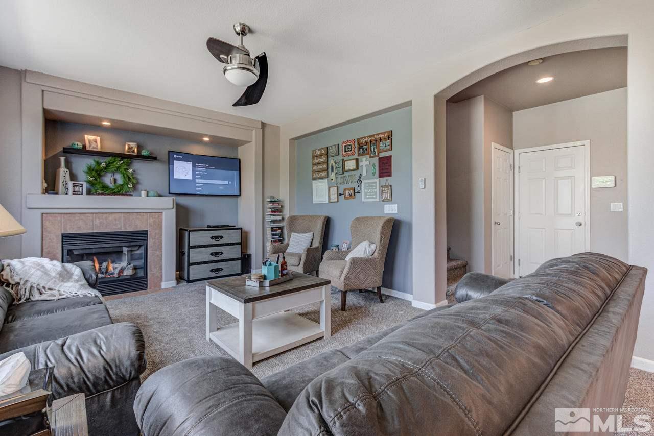 9275 Hummer Drive Reno, NV 89521 - Photo 8 of 33 a living room with furniture and a fireplace