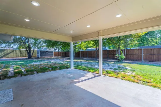 a view of a backyard with swimming pool
