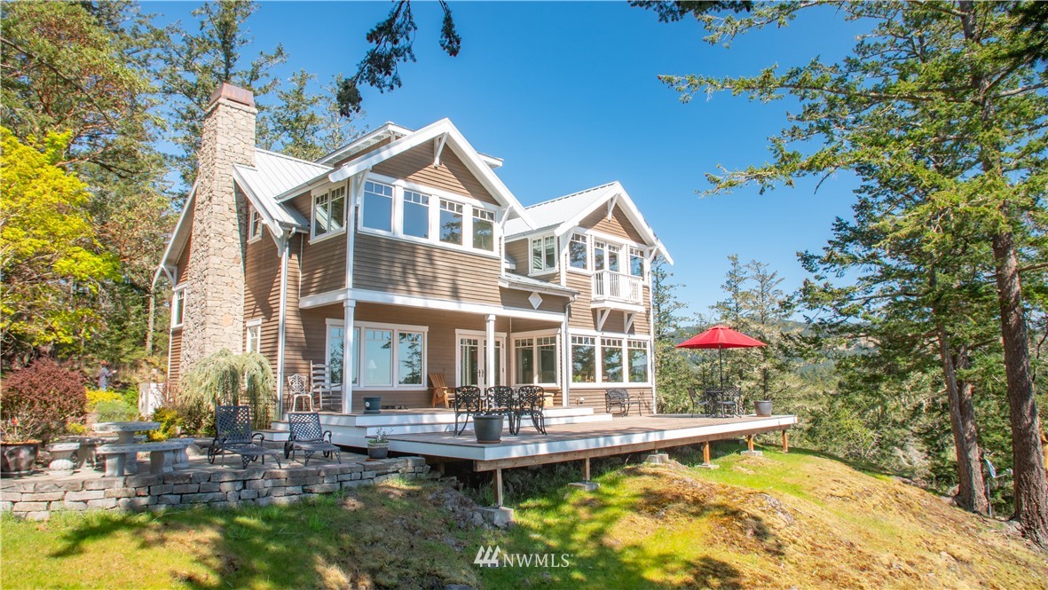 400 Cormorant Bay Road Orcas Island, WA 98245 - Photo 1 of 39 a front view of a house with swimming pool