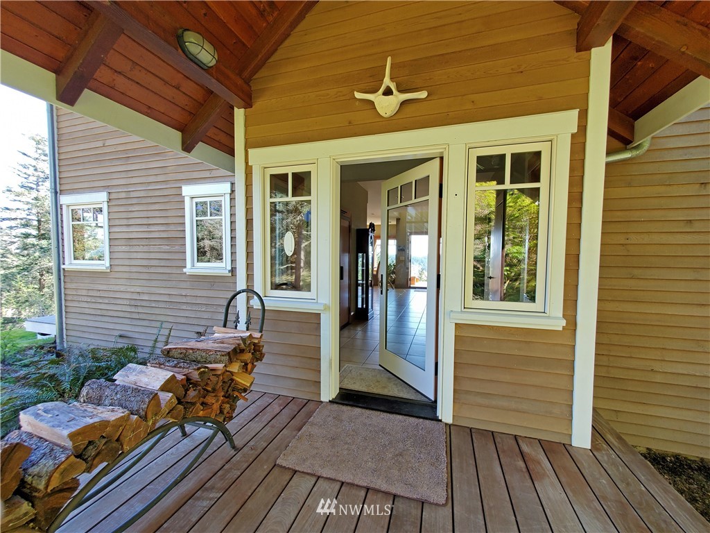 400 Cormorant Bay Road Orcas Island, WA 98245 - Photo 11 of 39 a view of a house with backyard and sitting area