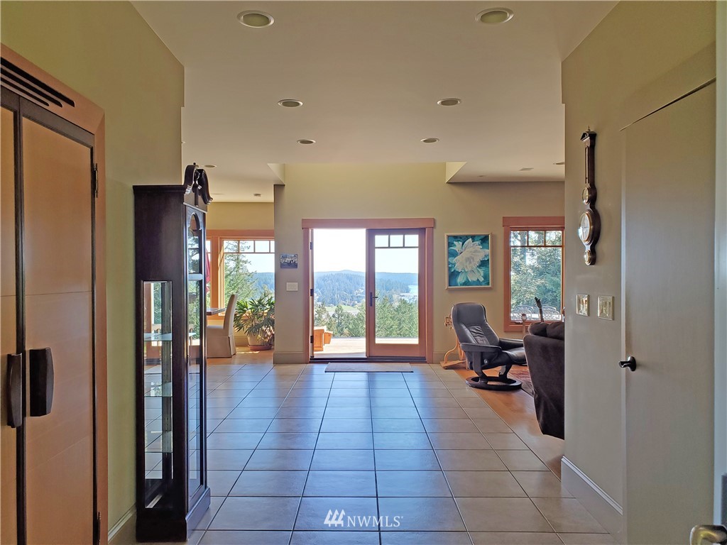 400 Cormorant Bay Road Orcas Island, WA 98245 - Photo 13 of 39 a lobby with furniture and floor to ceiling window