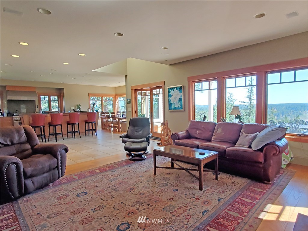 400 Cormorant Bay Road Orcas Island, WA 98245 - Photo 17 of 39 a living room with furniture and a large window