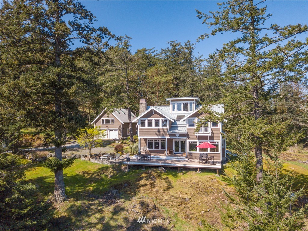 400 Cormorant Bay Road Orcas Island, WA 98245 - Photo 3 of 39 a front view of a house with swimming pool