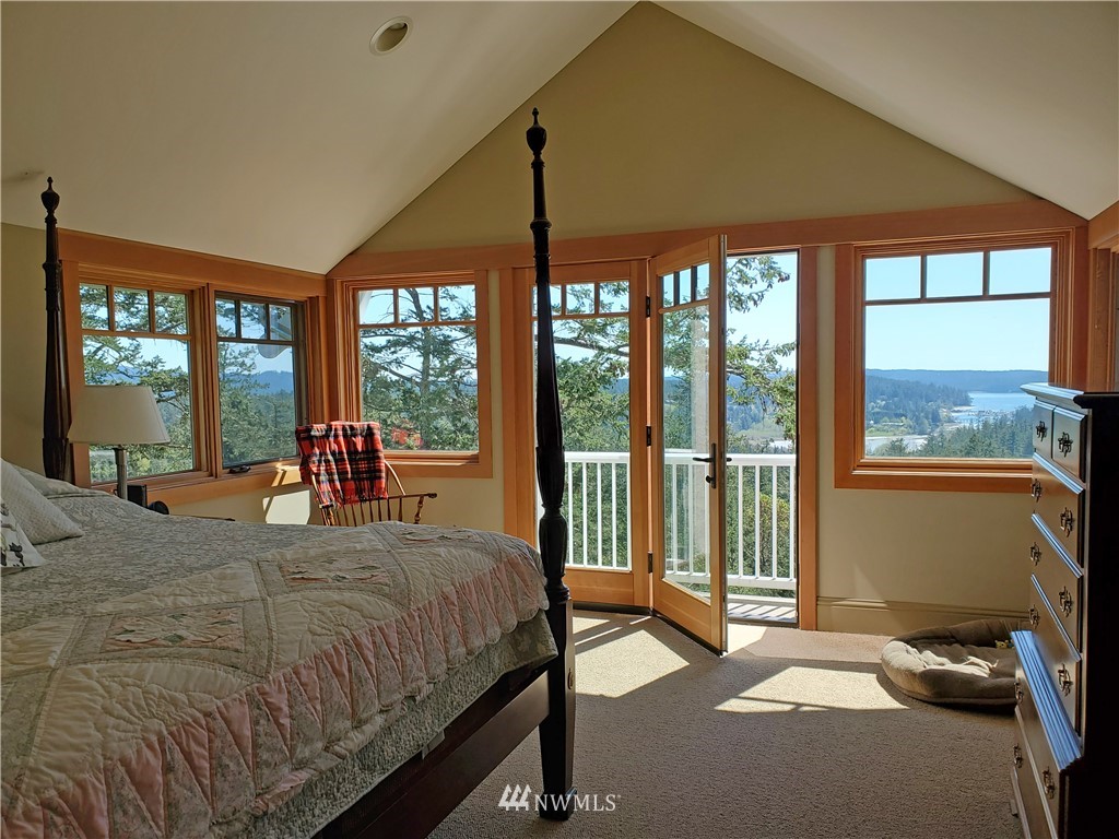 400 Cormorant Bay Road Orcas Island, WA 98245 - Photo 29 of 39 a bedroom with a bed and a large window