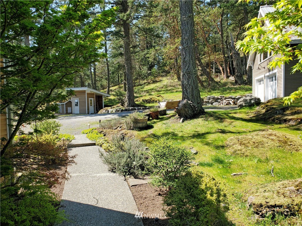 400 Cormorant Bay Road Orcas Island, WA 98245 - Photo 33 of 39 a view of swimming pool with lawn chairs and plants