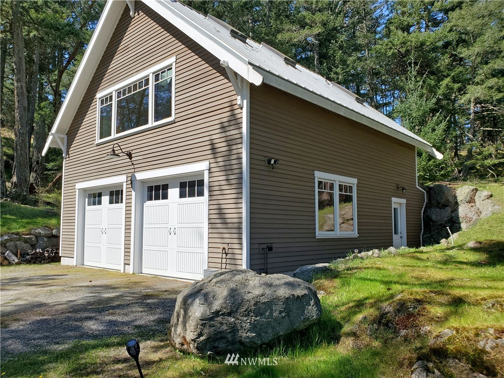 400 Cormorant Bay Road Orcas Island, WA 98245 - Photo 34 of 39 a front view of a house with garden