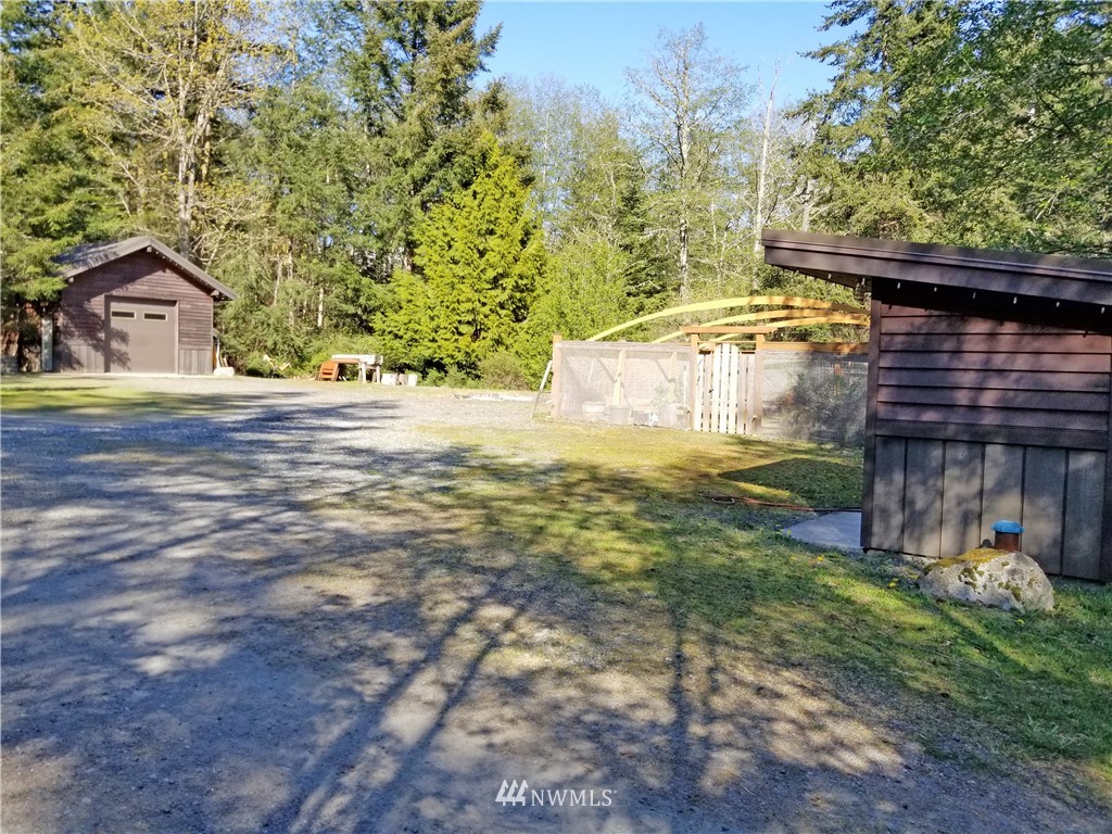 400 Cormorant Bay Road Orcas Island, WA 98245 - Photo 38 of 39 a backyard of a house with lots of green space