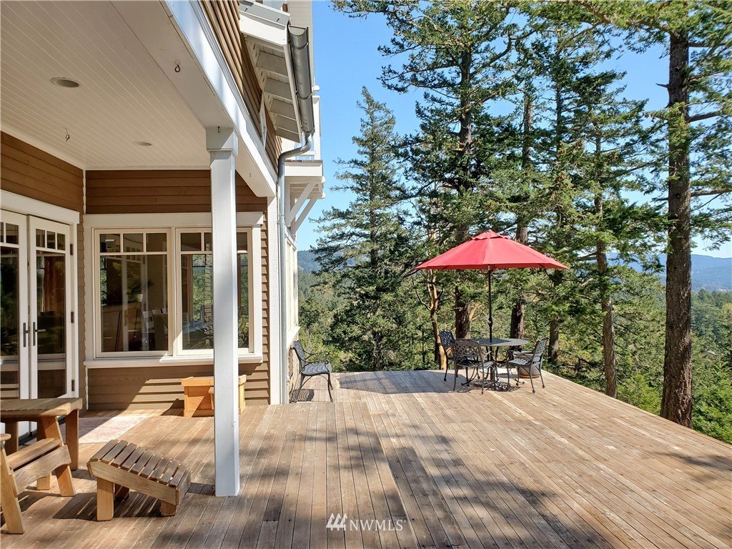 400 Cormorant Bay Road Orcas Island, WA 98245 - Photo 6 of 39 a outdoor space with furniture and umbrella