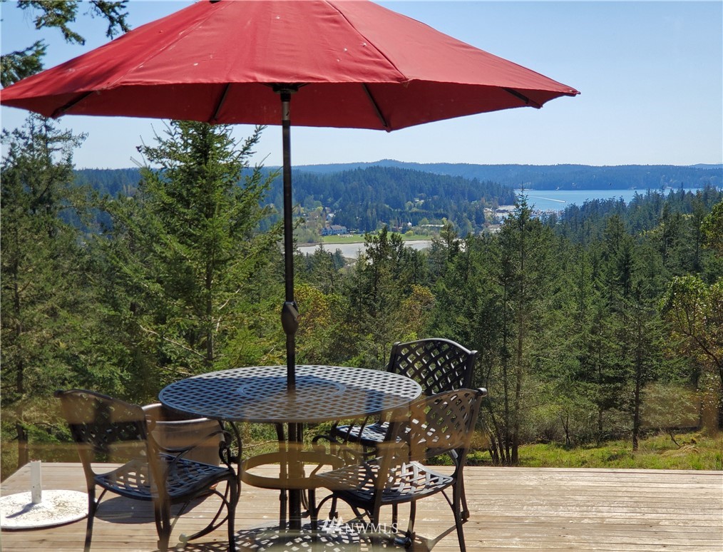 400 Cormorant Bay Road Orcas Island, WA 98245 - Photo 7 of 39 a view of a chairs and table in the patio