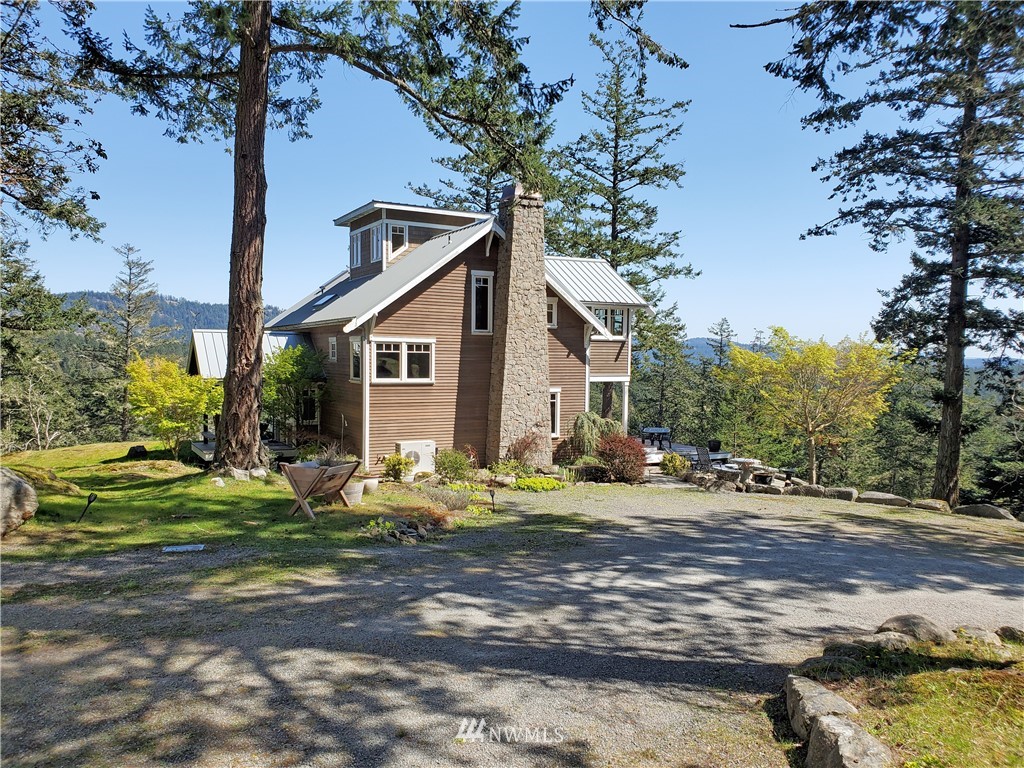 400 Cormorant Bay Road Orcas Island, WA 98245 - Photo 9 of 39 a front view of a house with garden