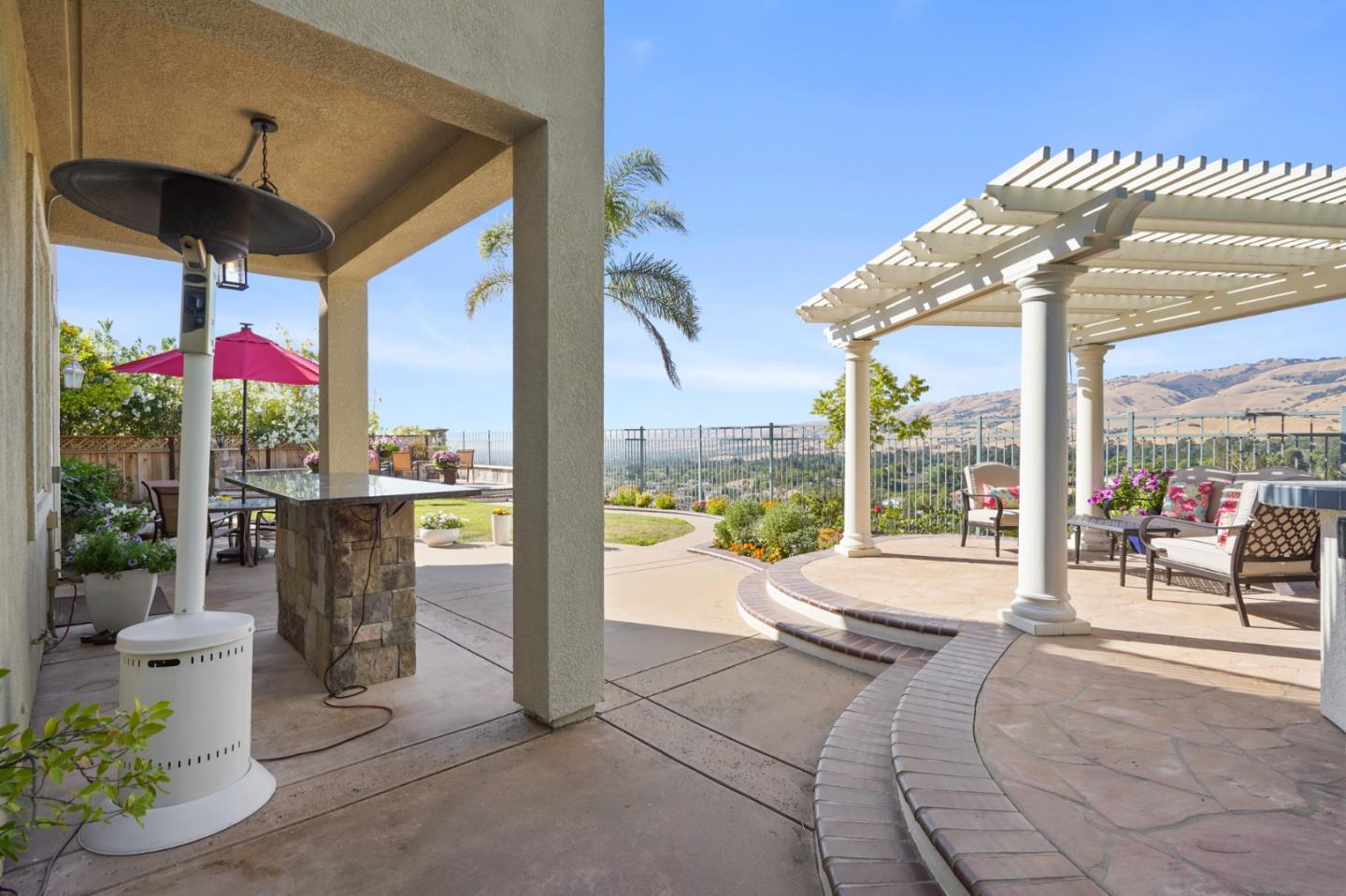 5793 Cannes Place San Jose, CA 95138 - Photo 22 of 29 a view of a patio with a table and chairs and potted plants