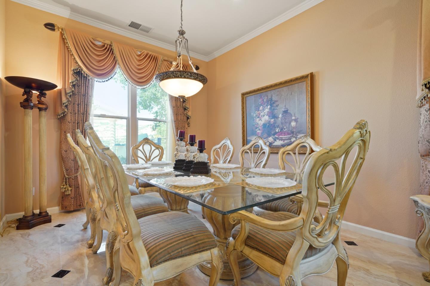 5793 Cannes Place San Jose, CA 95138 - Photo 3 of 29 a view of a dining room with furniture and a chandelier