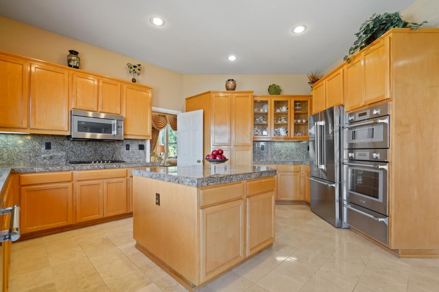5793 Cannes Place San Jose, CA 95138 - Photo 4 of 29 a kitchen with stainless steel appliances granite countertop a sink and cabinets