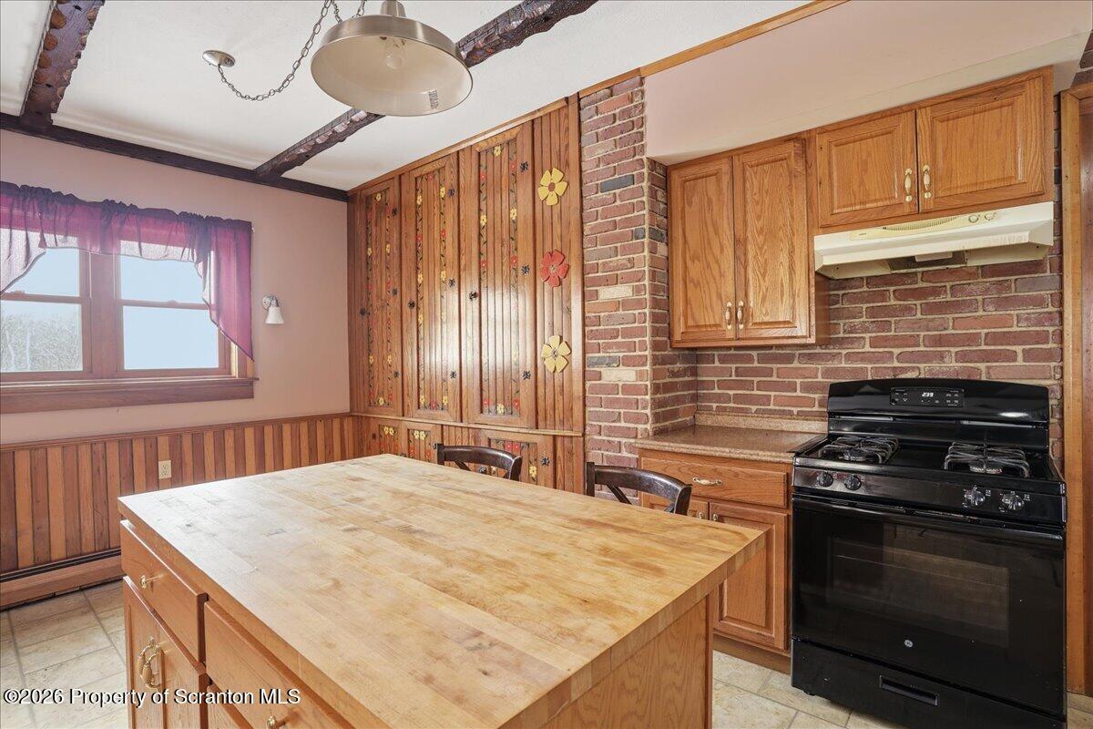 795 Wescott Road New Milford, PA 18834 - Photo 34 of 81 a kitchen with a stove and a microwave