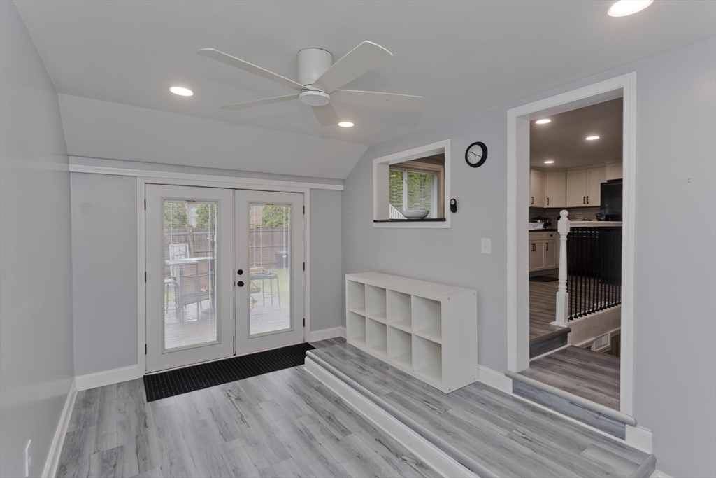 83 Chalmers Street Springfield, MA 01118 - Photo 14 of 40 a view of a hallway with wooden floor and a living room