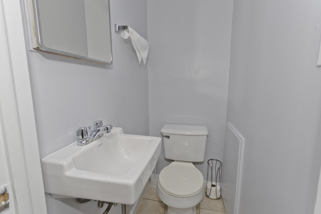 83 Chalmers Street Springfield, MA 01118 - Photo 33 of 40 a white toilet sitting next to a white sink