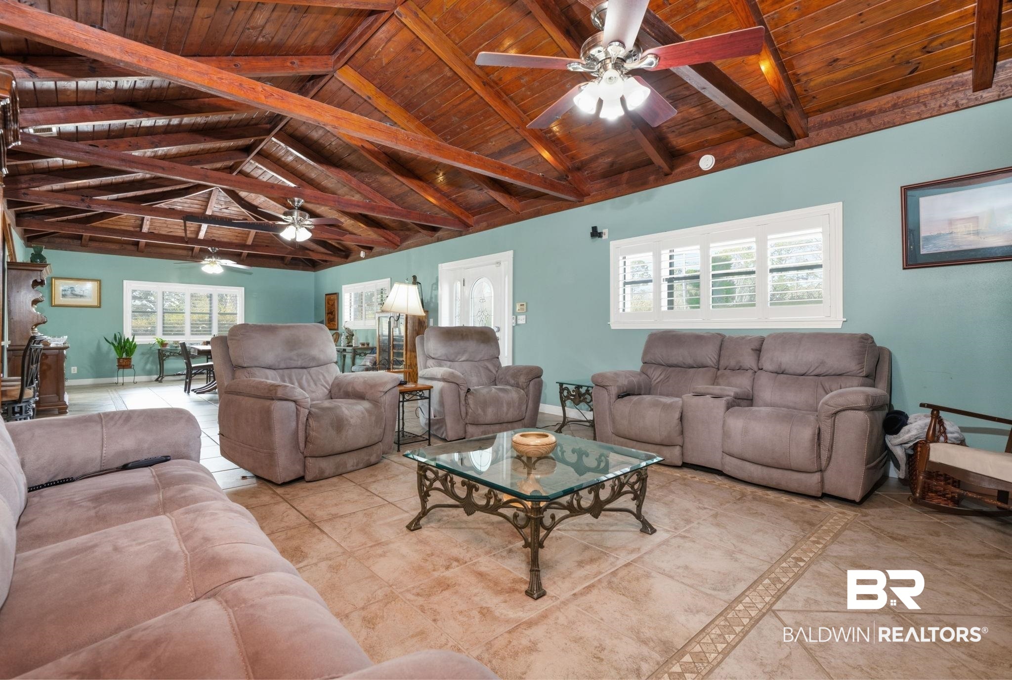15025 Bellingrath Road Coden, AL 36523 - Photo 37 of 79 Living room with a ceiling fan, a high wooden beamed ceiling, and healthy amount of natural light