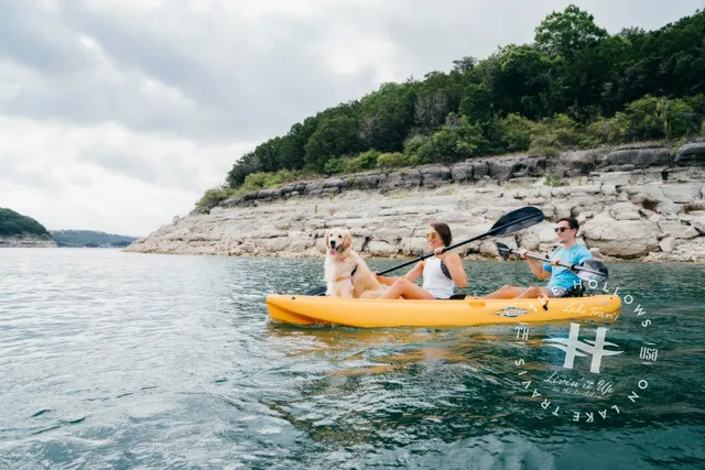 a view of backyard with a table and chairs and a fire pit
