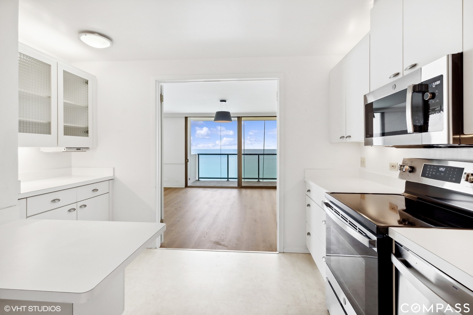 1500 Sheridan Road, Unit 9K Wilmette, IL 60091 - Photo 8 of 29 a kitchen with stainless steel appliances a stove microwave and sink