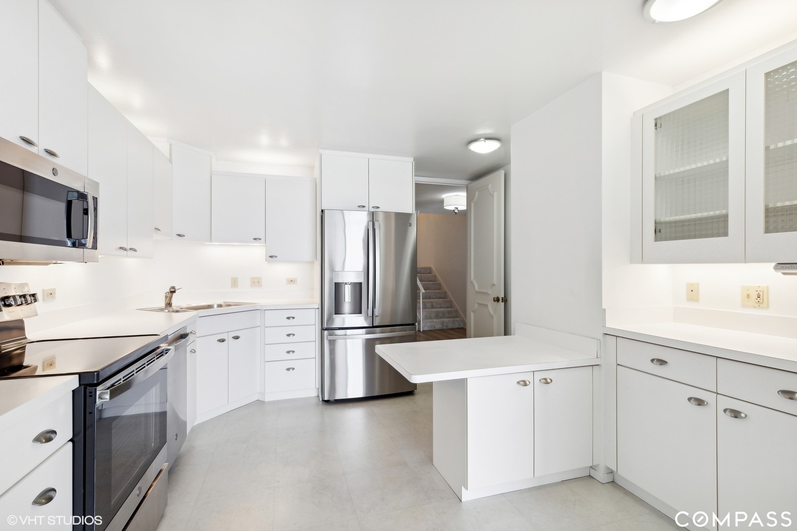 1500 Sheridan Road, Unit 9K Wilmette, IL 60091 - Photo 9 of 29 a kitchen with white cabinets and refrigerator