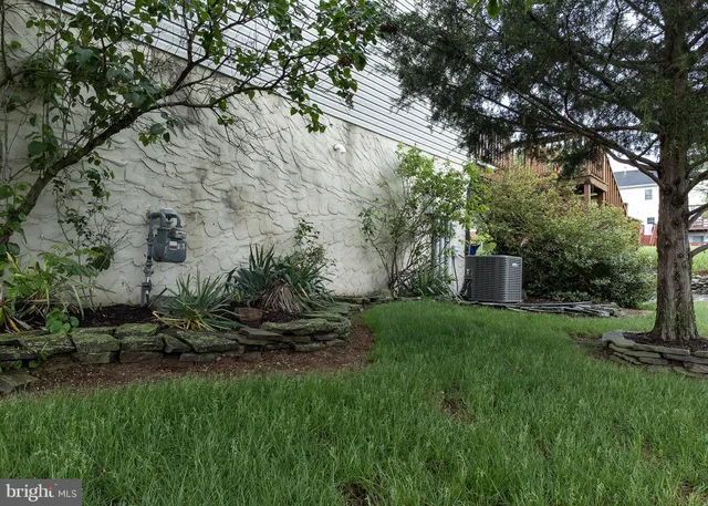 a kitchen with stainless steel appliances granite countertop a refrigerator stove and sink