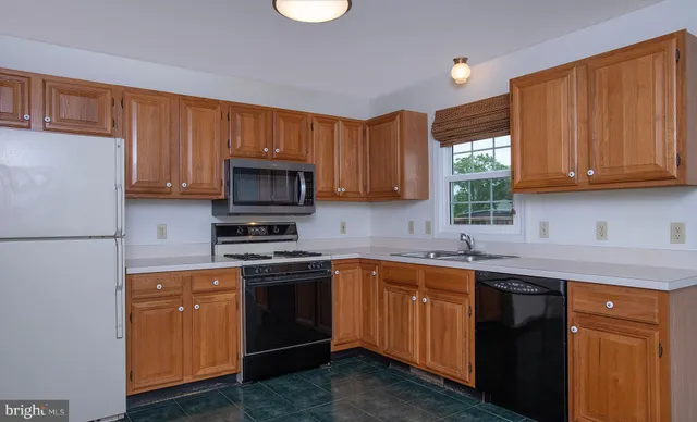 a view of an empty room with a fireplace