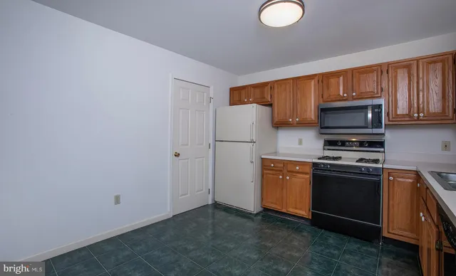 a view of an empty room with a fireplace