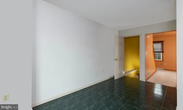 a view of a livingroom with a ceiling fan and window
