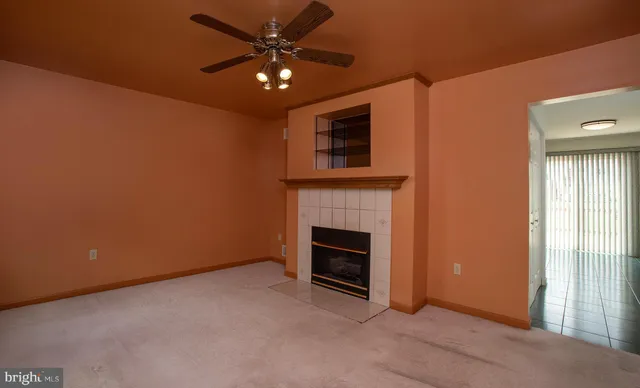 a view of a livingroom with a walk in closet and bathroom