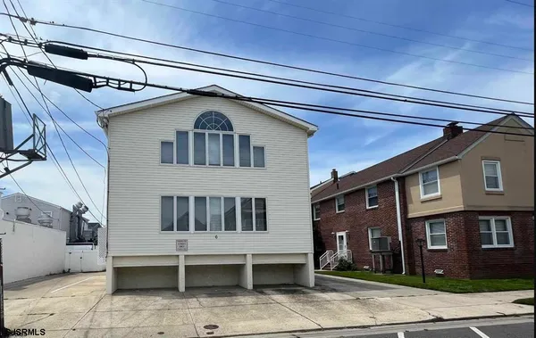a front view of a house with a garage