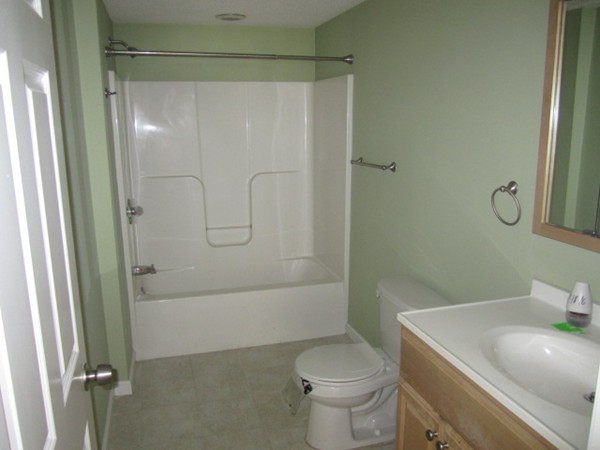 93 Stuart Street Springfield, MA 01119 - Photo 17 of 24 a bathroom with a sink a toilet and shower