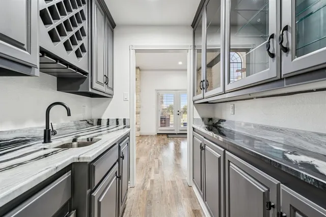 a kitchen with stainless steel appliances granite countertop a sink and cabinets