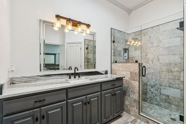 a bathroom with a granite countertop sink mirror and double