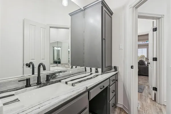 a bathroom with a sink and a mirror