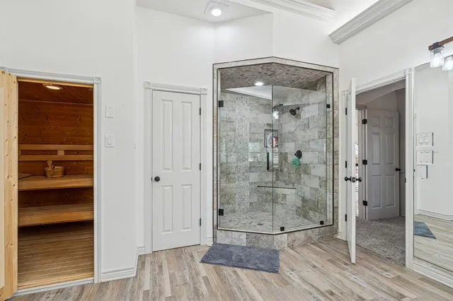 a living room with furniture a flat screen tv and a large window