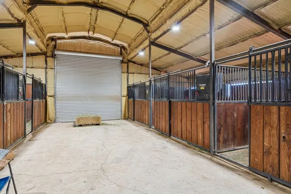 a view of a house with a yard and a garage