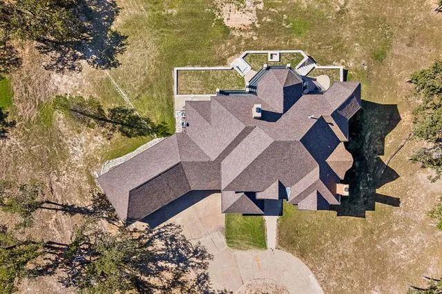 a front view of a house with a large swimming pool