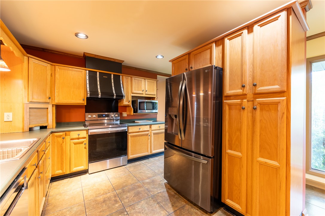 139 Todds Creek Road Central, SC 29630 - Photo 5 of 45 This efficient kitchen offers ample cabinetry and modern appliances, creating a highly functional cooking space.
