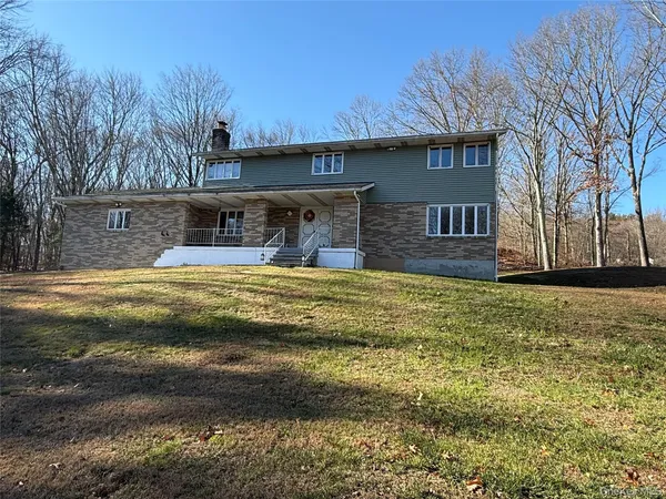 a swimming pool with outdoor seating area