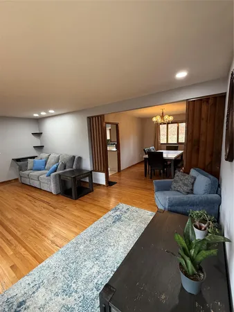 a living room with furniture and a table