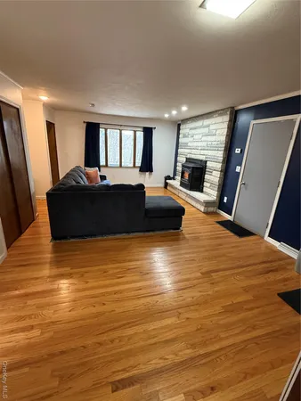 a bed room with furniture and a flat screen tv