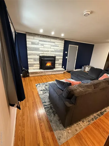 a room with bed and a fireplace