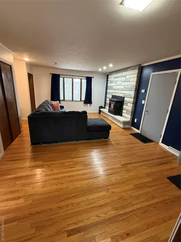 a bed room with furniture and a flat screen tv