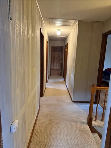 a bathroom with a granite countertop sink a toilet and a mirror