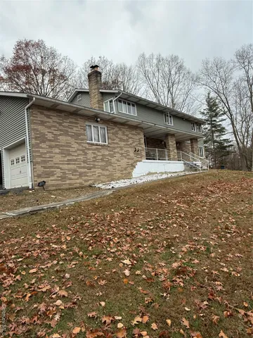a front view of a house with yard