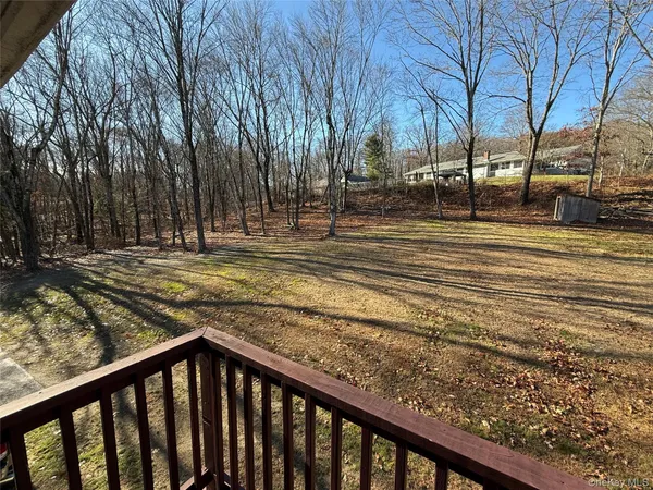 a view of pathway with a wrought fence