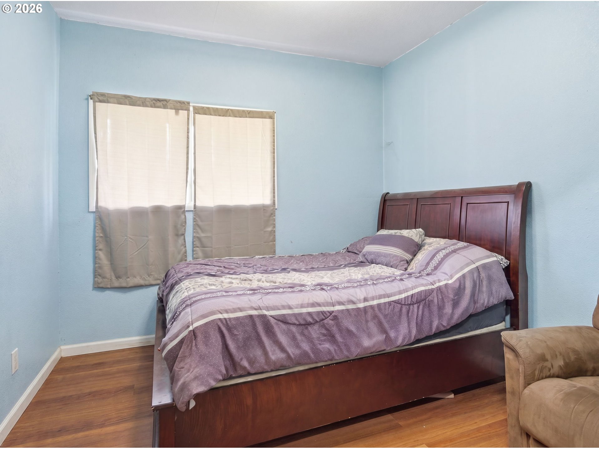 1357 Grove Street Lebanon, OR 97355 - Photo 19 of 37 a bed sitting in a bedroom next to a window