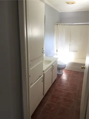 a bathroom with a double vanity sink and a bathtub