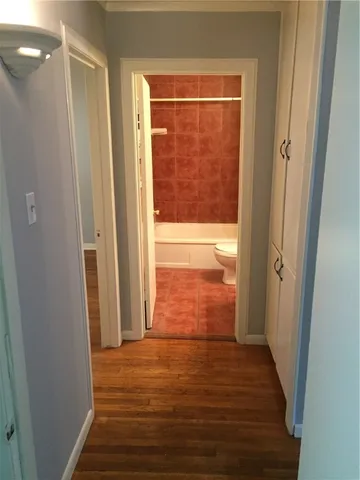 a view of a bathroom from a hallway