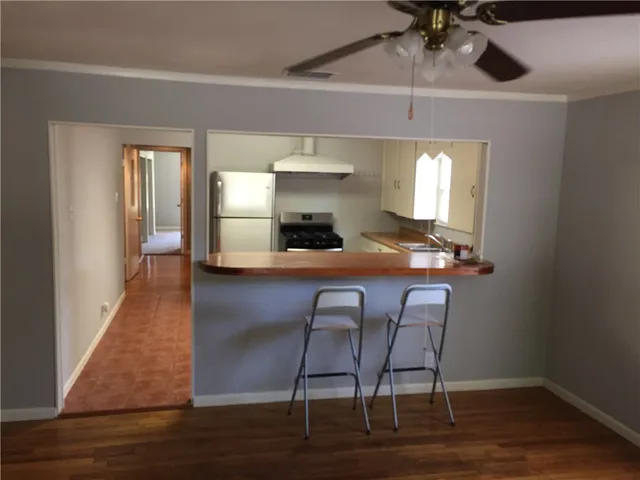 a view of a livingroom with furniture and wooden floor